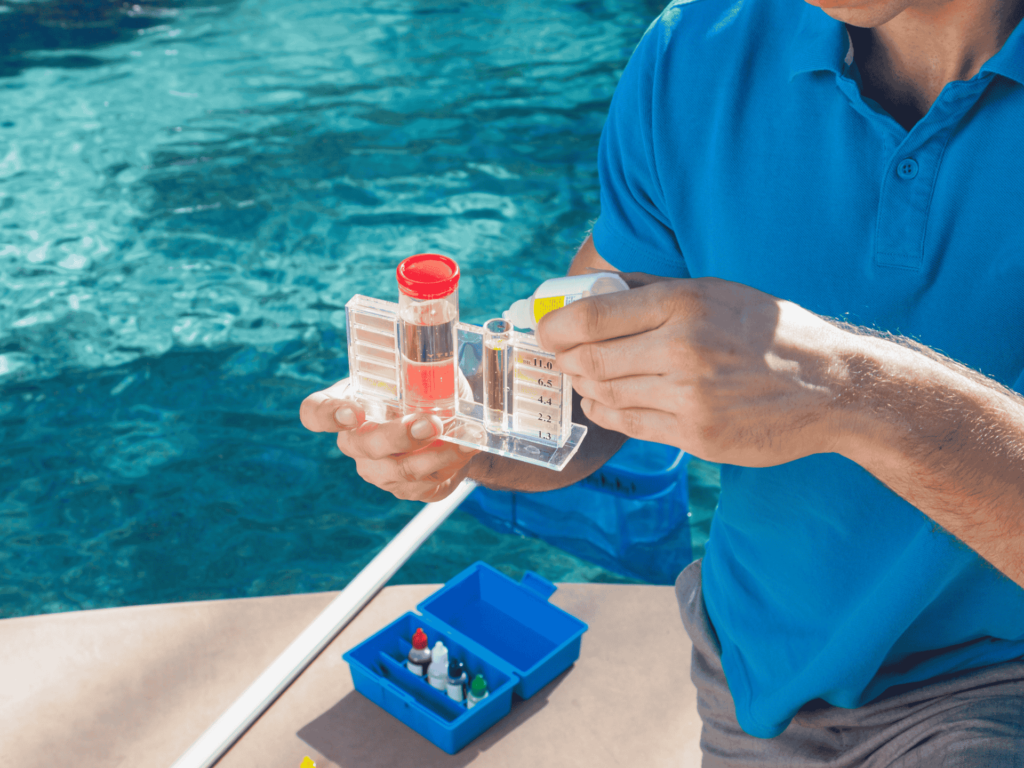 Technician performing pool cleaning service in Beverly Hills, CA