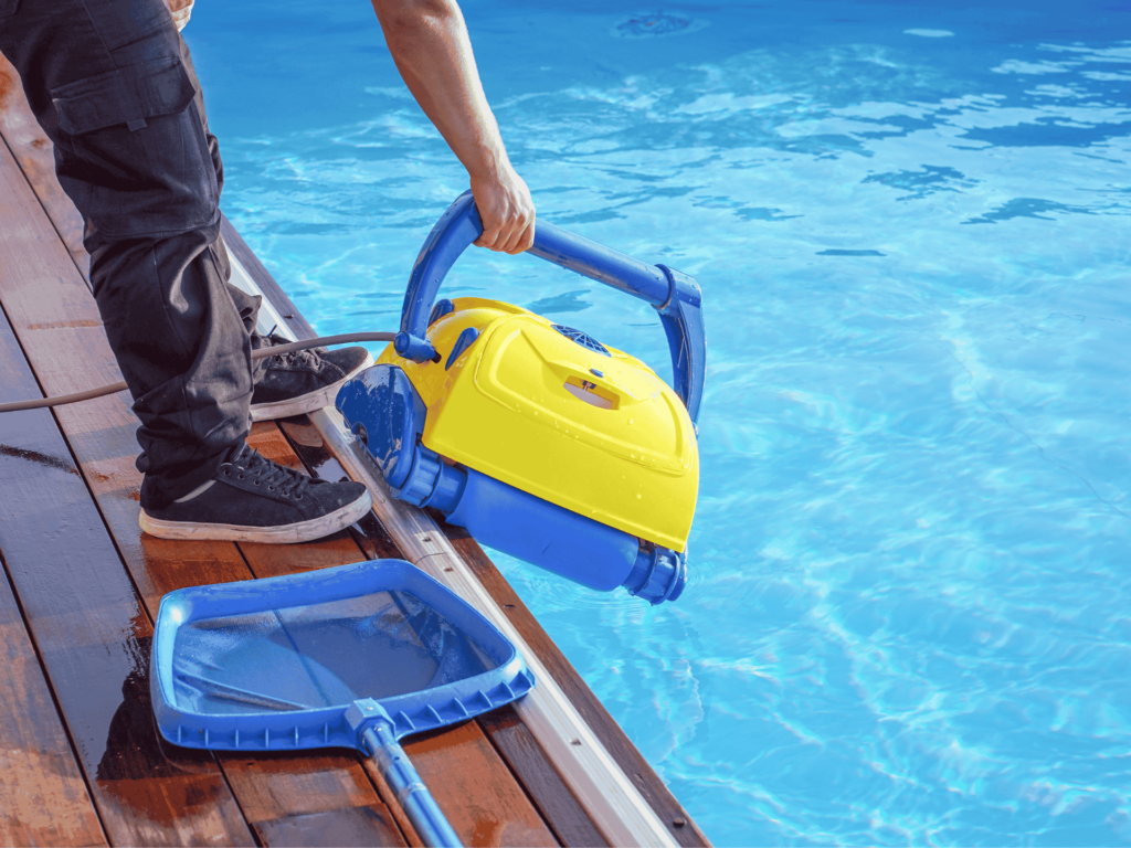 Technician cleaning a residential pool in Granada Hills, CA